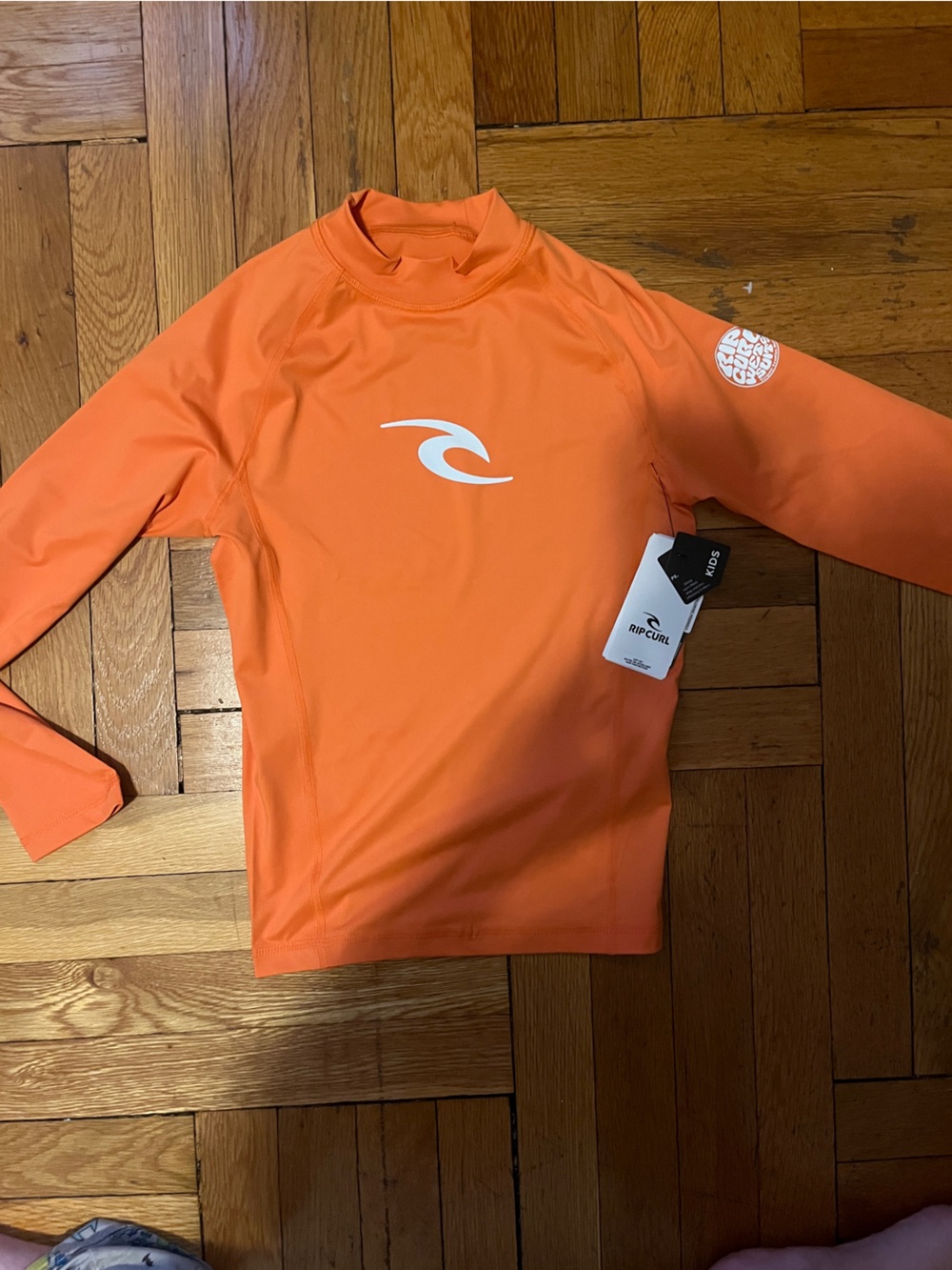 NWT - Rip Curl Bright Orange Kids Long Sleeve Rashguard - size 12 UPF 50